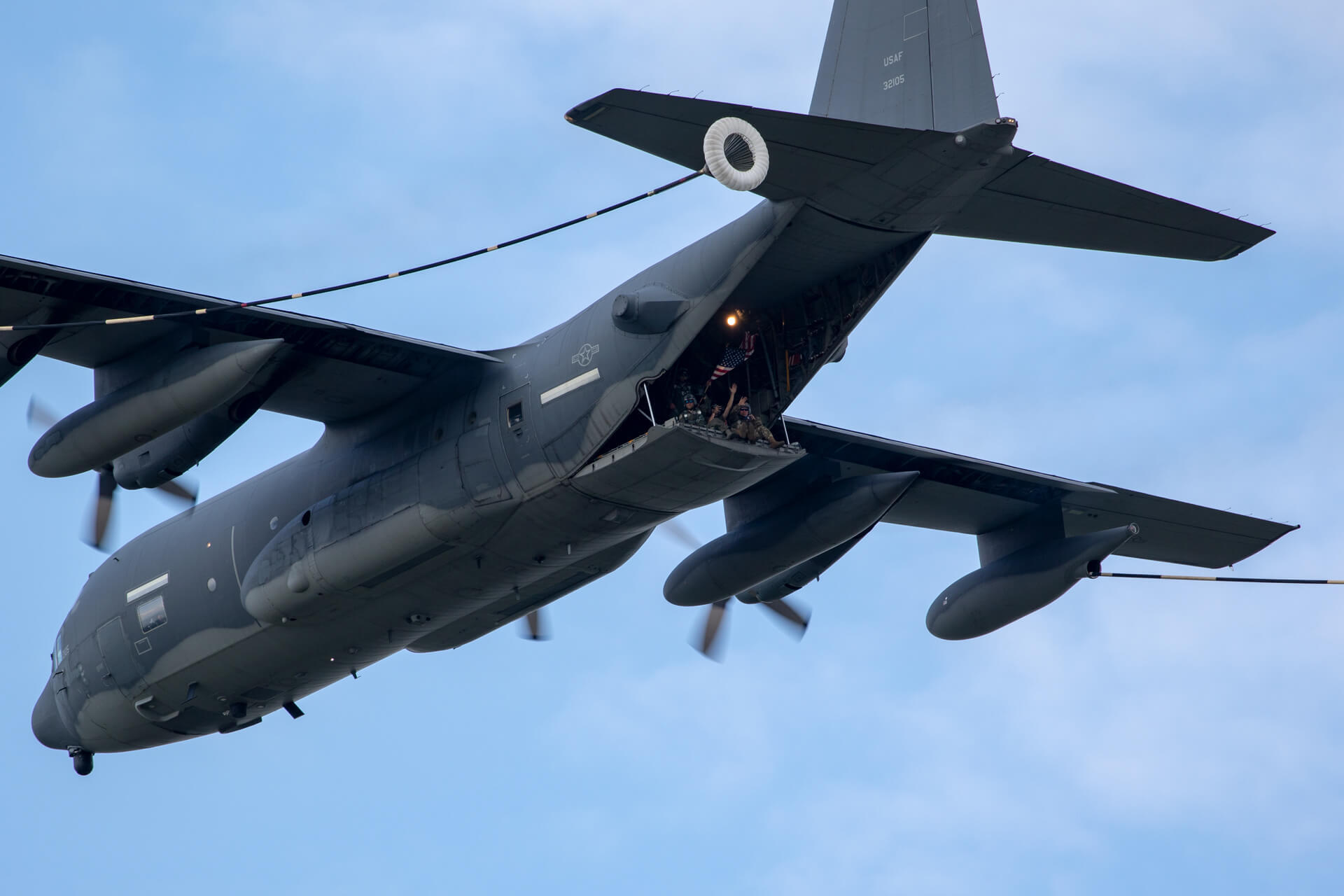 Lockheed Martin C-130J Super Hercules demonstrates refueling capabilities; while airman checkout AirVenture from above.