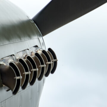 Exhaust from a WWII-era prop engine plane.