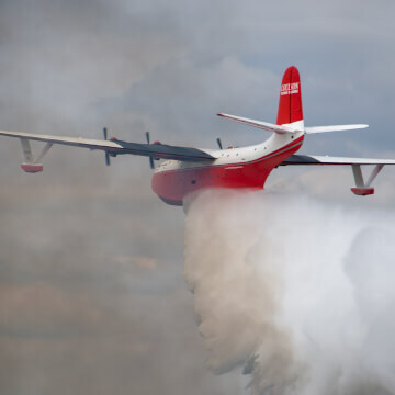 Martin Mars (Hawaii) extinguishes a fire at EAA Oshkosh 2016.